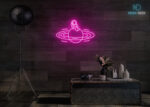 Astronaut Sitting on Solar Neon Sign Hot-Pink